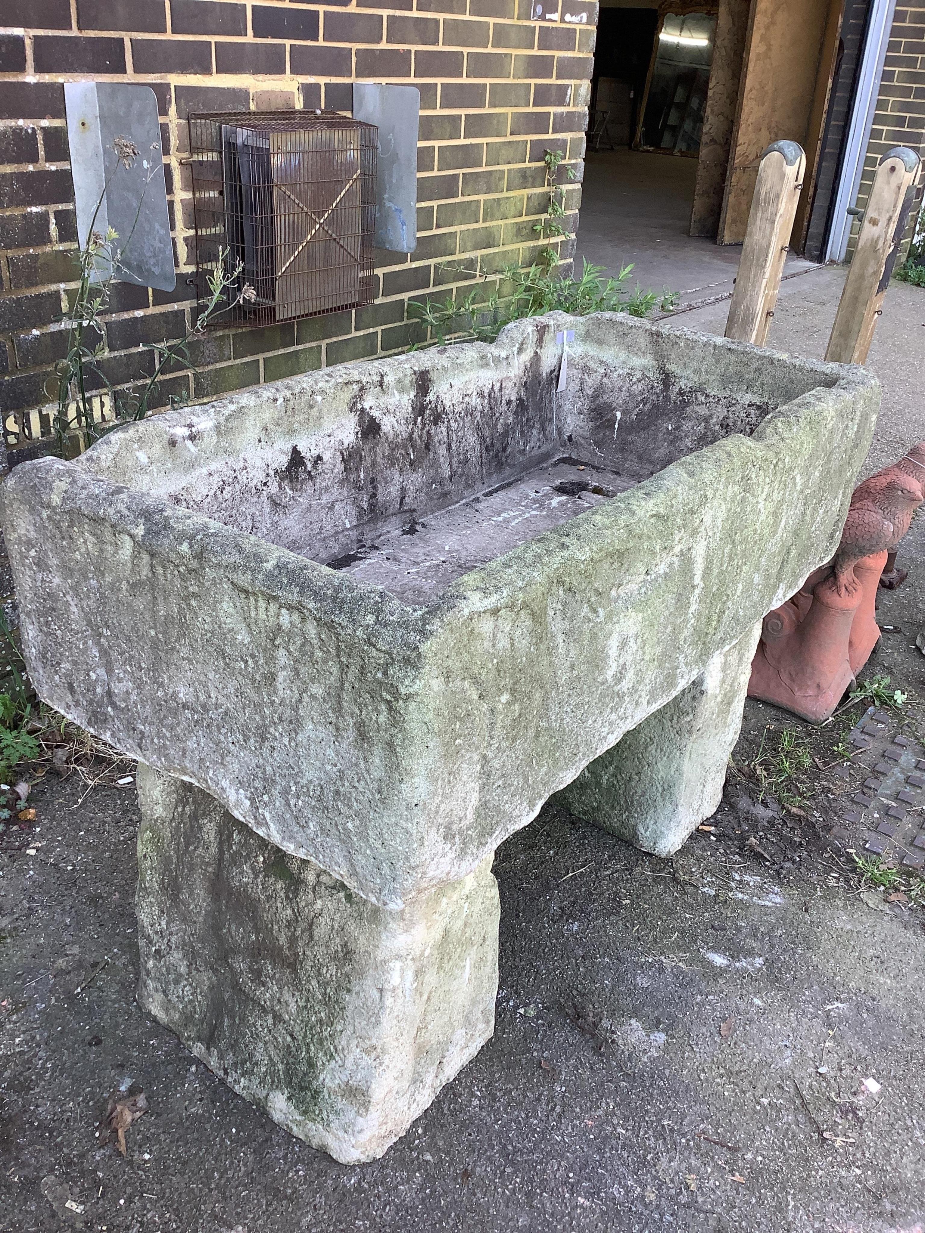 A stone trough, width 122cm, depth 60cm, height 84cm. Condition - fair